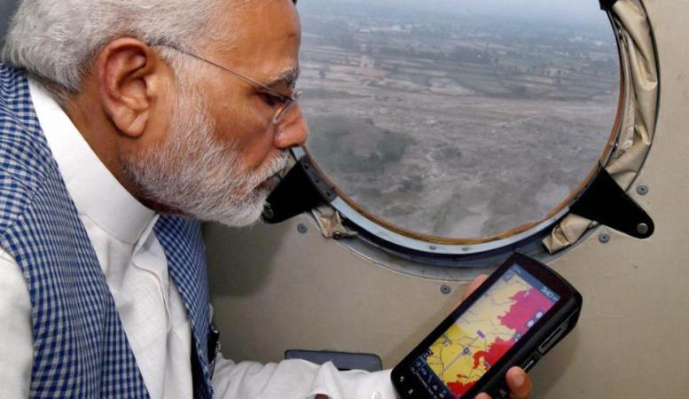 Prime Minister Narendra Modi conducting an aerial survey of flood affected areas of Gujrat, Photo: H.T. Prime Minister Narendra Modi conducting an aerial survey of flood affected areas of Gujrat, Photo: H.T.